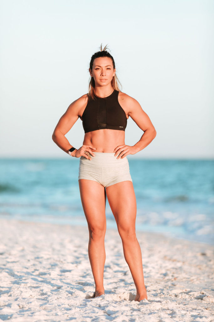 Fitness model on the beach during Gym and Outdoor Fitness Photography Session Tips and Ideas by Navarre Florida Fitness photographer, Adina Preston.