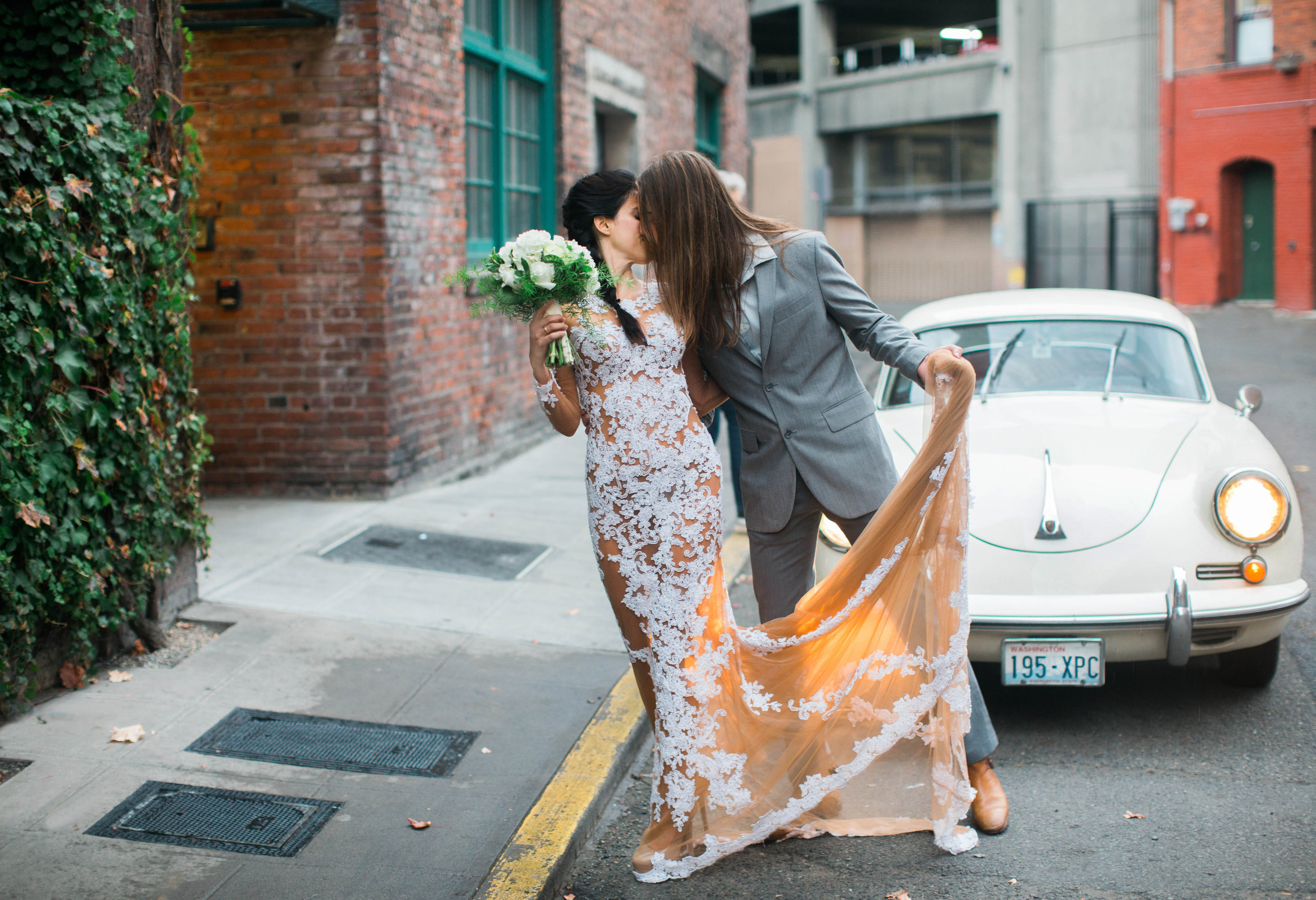 wedding couple kissing in pioneer square