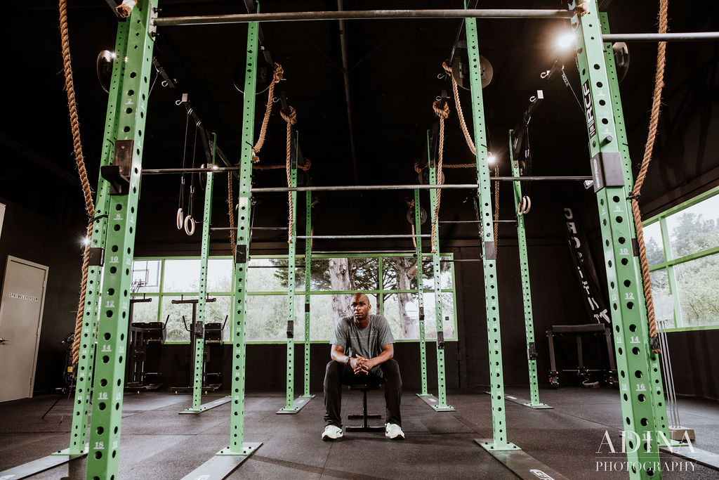 Norris Frederick, a professional in the sport of track & field, 3X bronze medalist, and CrossFit athlete working out for a fitness photo session in Pensacola, Florida