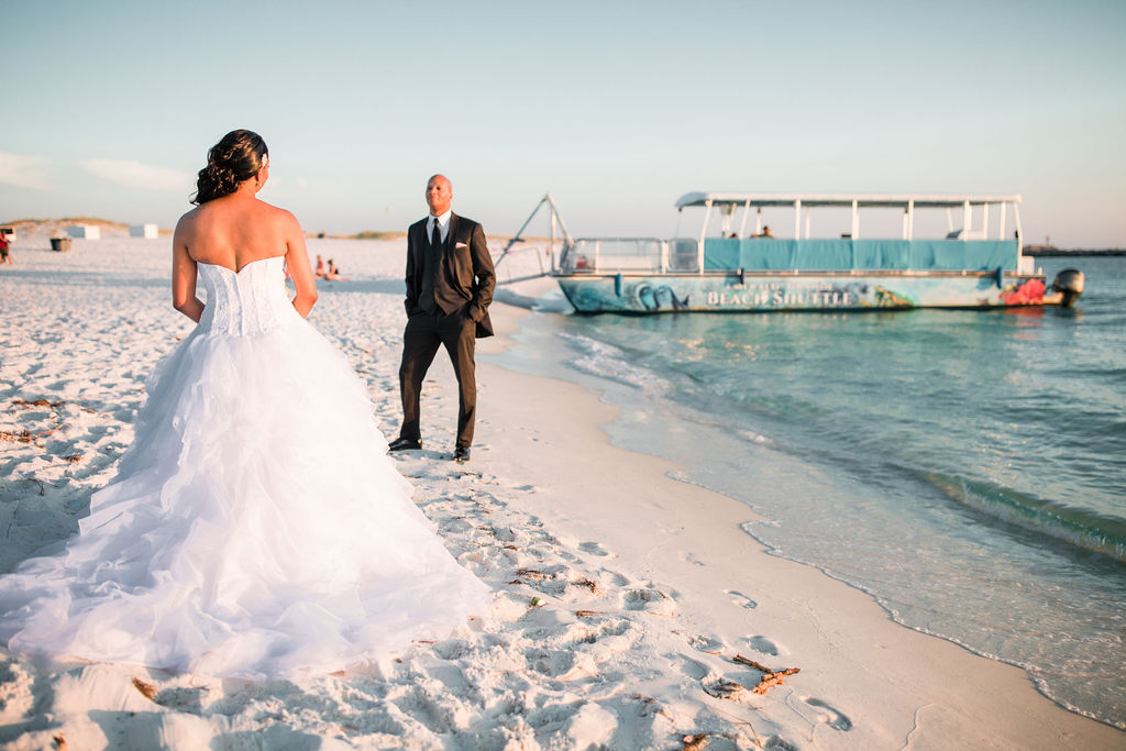 Beach wedding portraits at sunset of an African-American couple that got married at the Emerald Grande Resort in Destin, Florida