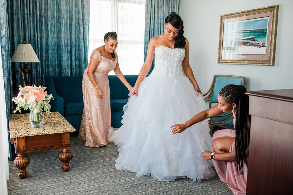 bride getting ready at the Emerald Grande Resort suite in Destin with her bridesmaids