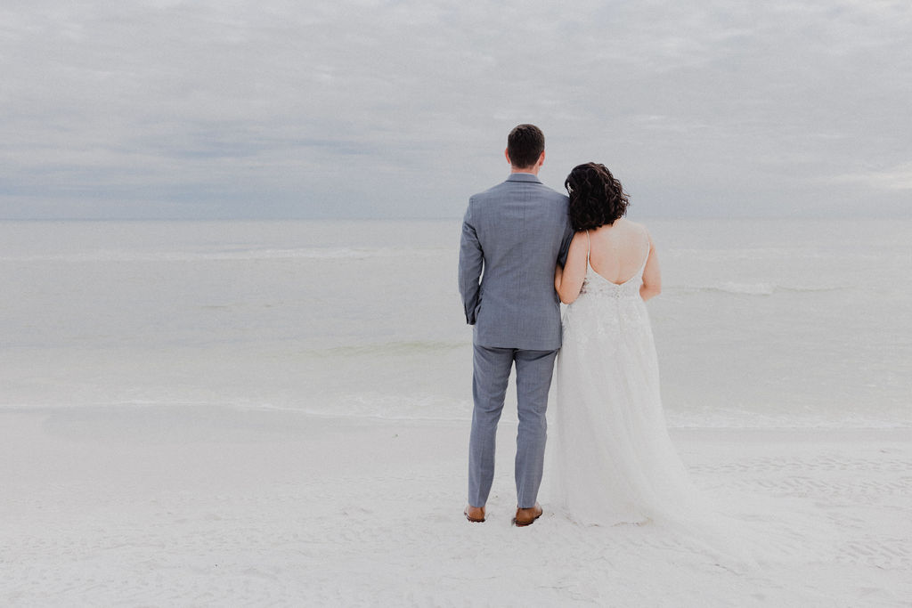 Couple walking on the beach after the ceremony during Destin Wedding photoshoot at the Henderson Resort in Destin, Florida during the pandemic COVID-19