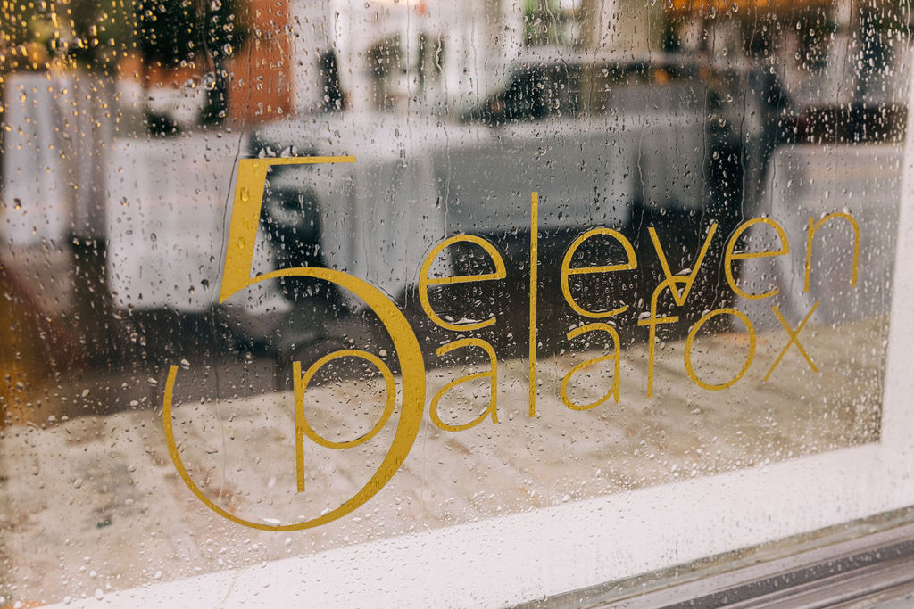5Eleven Palafox rainy window sign