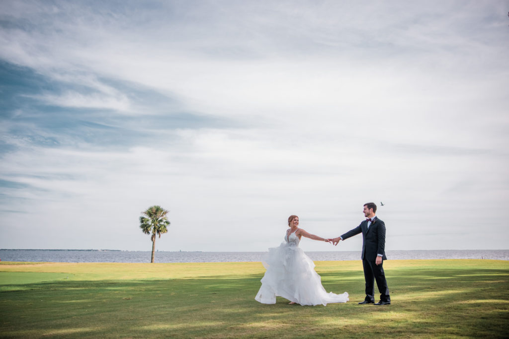 pensacola country club wedding with the best bay view behind the couple during the bridal portraits