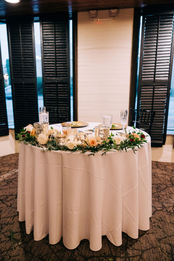 Palafox Wharf Waterfront Wedding event venue featuring wedding table flower details 