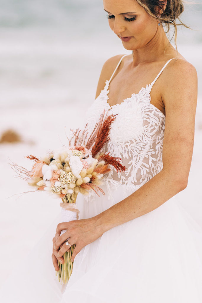 Wedding flower bouquet during her photography session in Pensacola Beach.