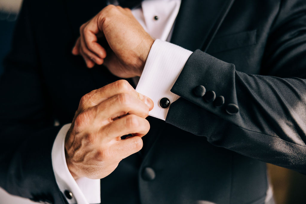 Groom wedding attire detail photograph of a shirt cufflink worn during an elopement. 