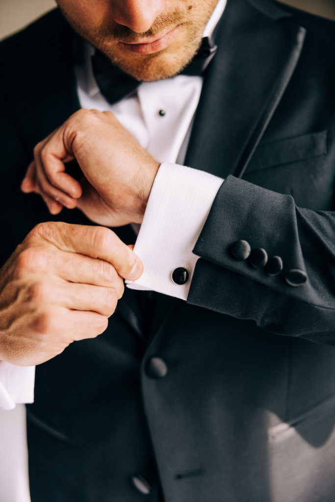 Groom wedding attire detail photograph of a shirt cufflink worn during an elopement. 